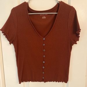 AE burnt orange button T